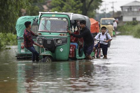Flooding displaces tens of thousands and kills 1 as heavy monsoon rains batter Indian villages
